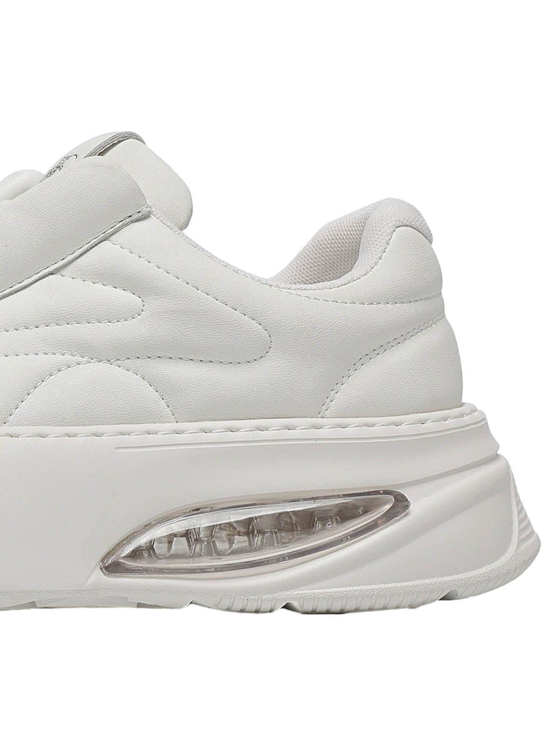 A close-up of TALISHKO retro platform skate shoes, highlighting the cushioned sole design.