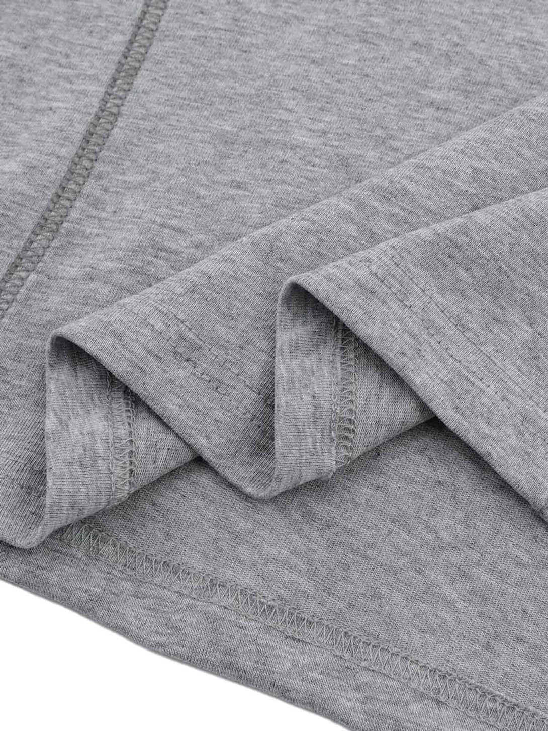 A zoomed-in look at the fabric and stitching of a gray retro quilted T-shirt by TALISHKO.