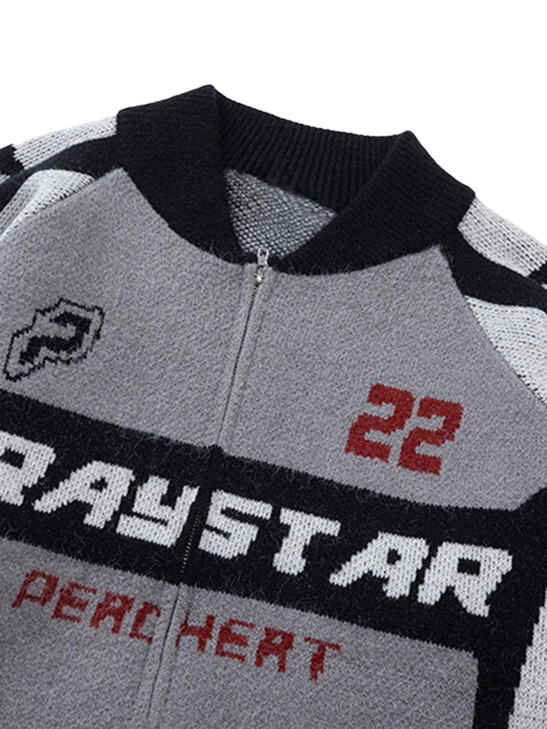 A detailed view of TALISHKO's retro racing bomber sweater jacket, highlighting gray and black graphics.