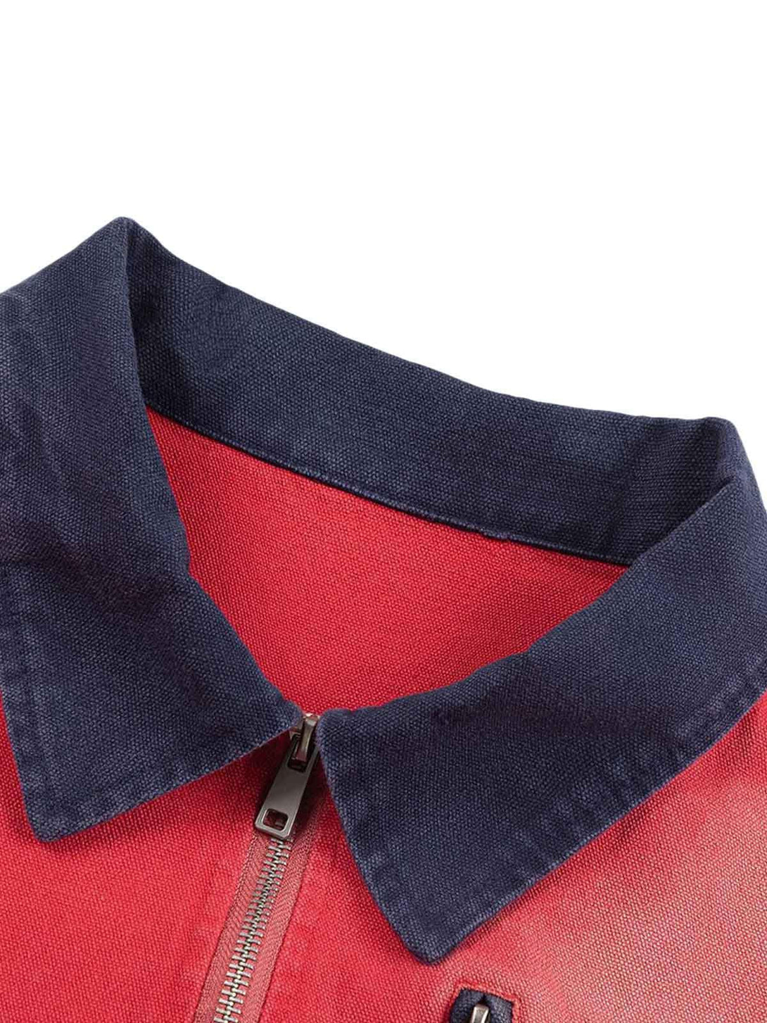 A close-up of TALISHKO's retro work jacket, highlighting the contrasting navy collar and zipper.