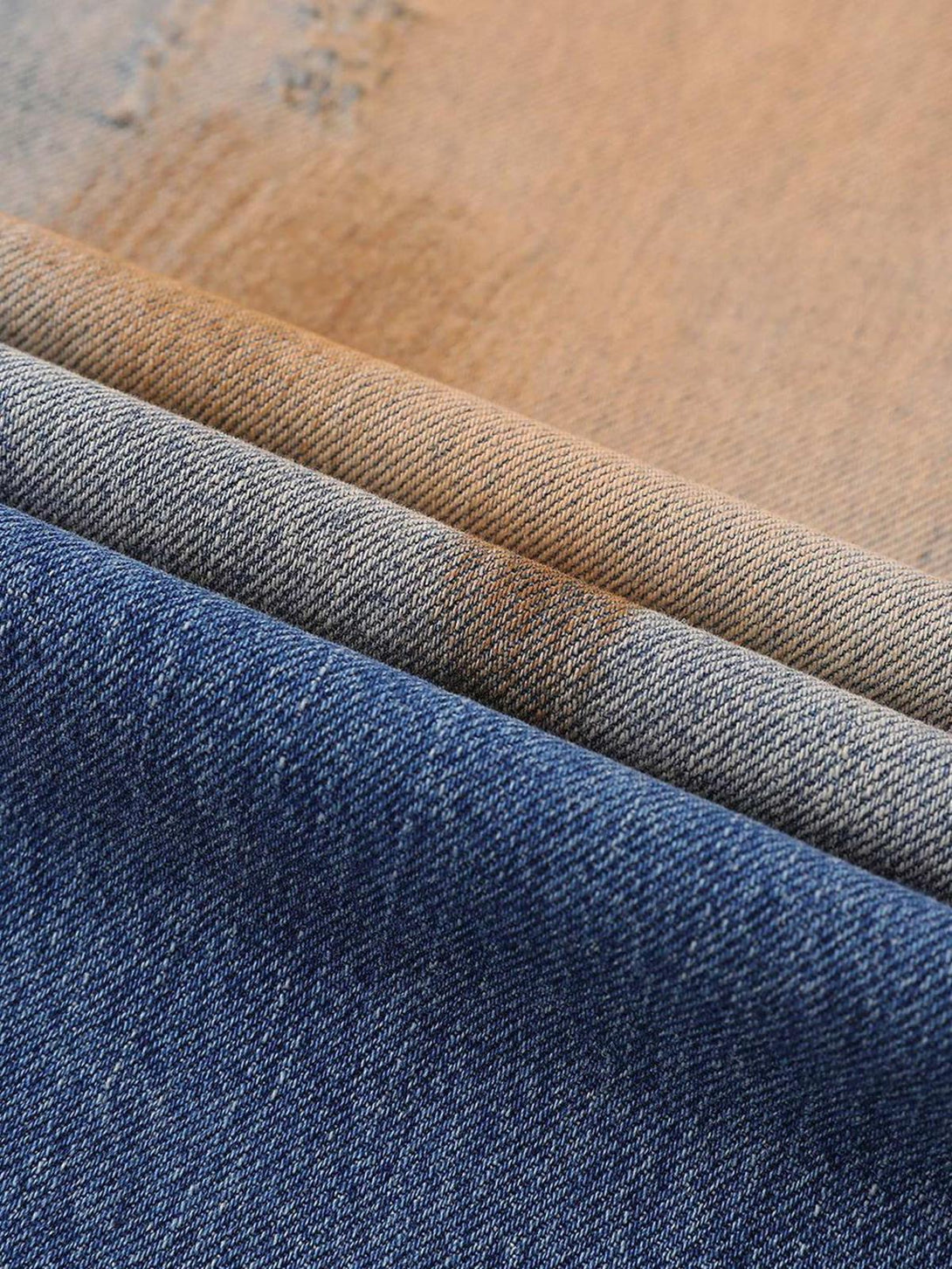 Texture and pattern showcased in TALISHKO's retro hip-hop jeans with a washed patina effect.