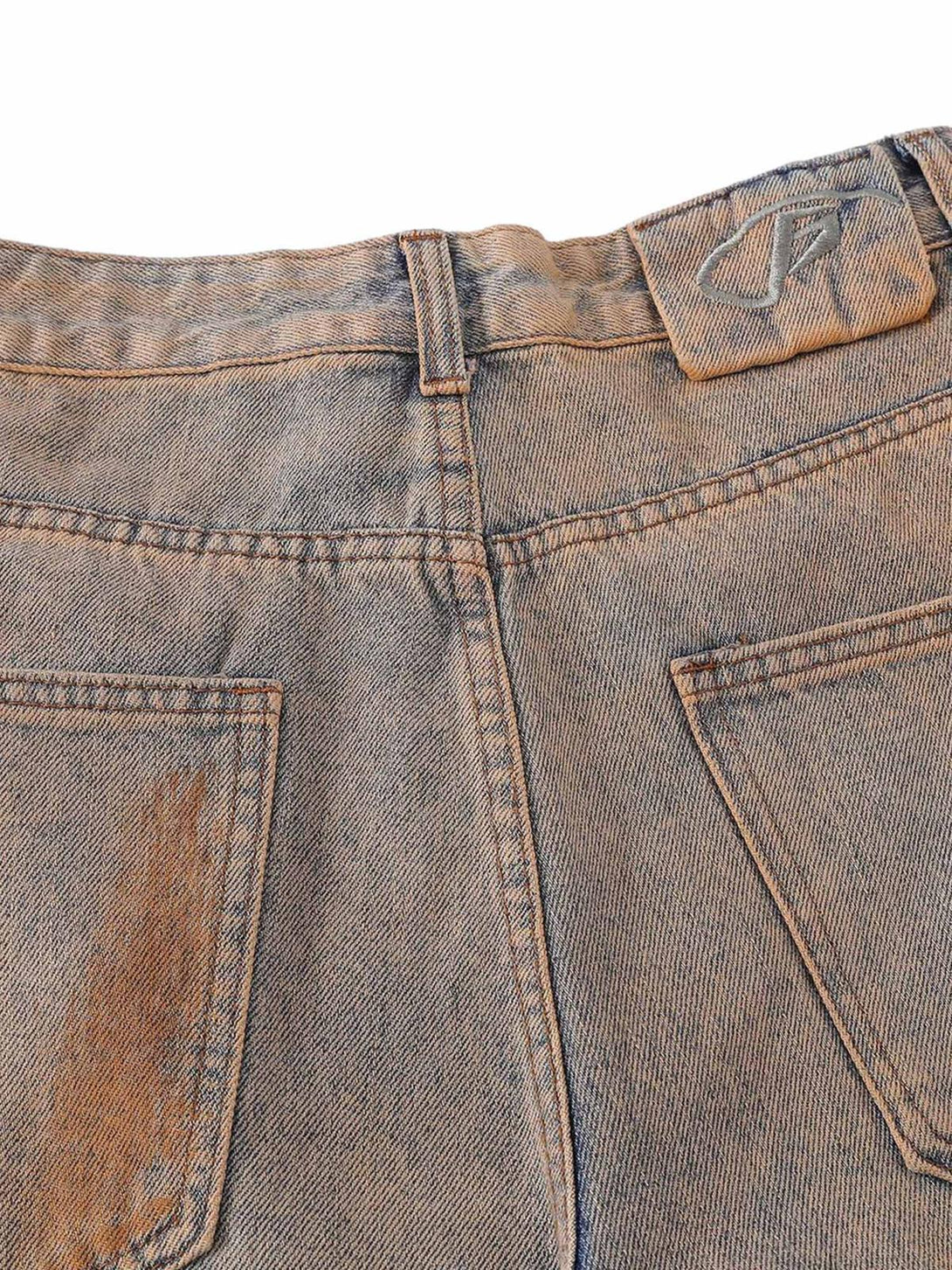 Close-up of TALISHKO's retro hip-hop jeans, highlighting the back pocket detail and patina.