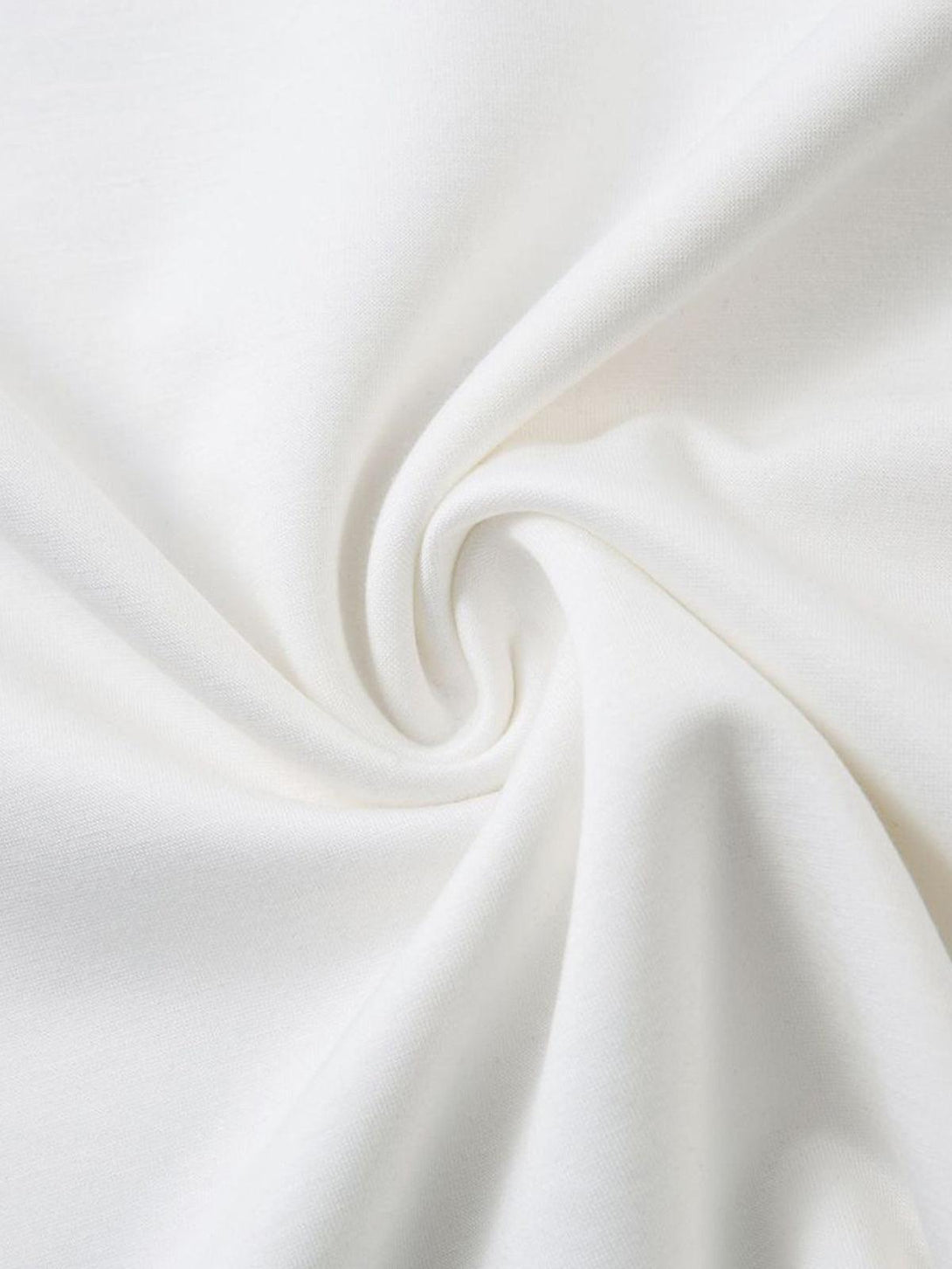 Zoomed-in texture of TALISHKO T-shirt fabric, highlighting its smooth, soft material.