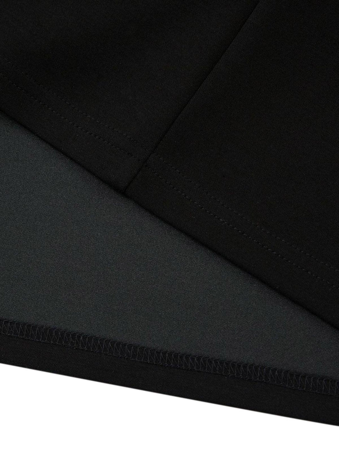 Detailed fabric and stitching in black, showcasing TALISHKO's retro pleated T-shirt design.