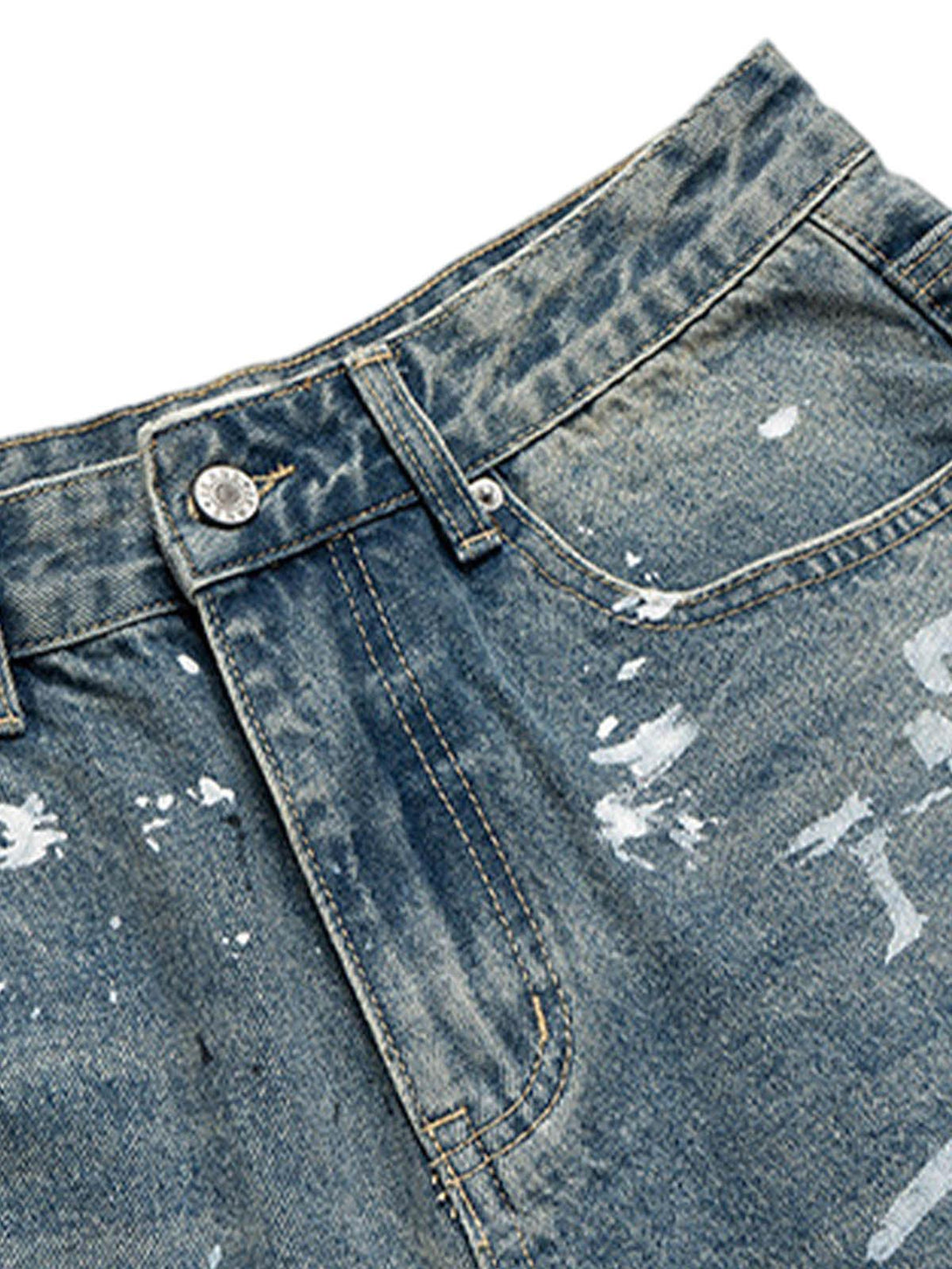 A detailed view of TALISHKO's cropped denim shorts, highlighting the retro distressed texture.