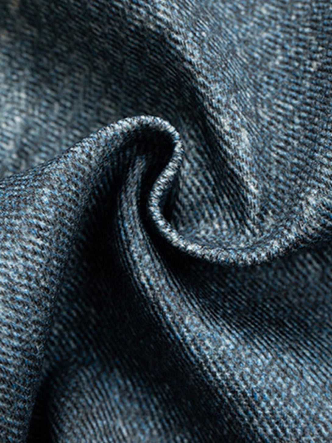 Zoomed-in texture of TALISHKO's denim fabric, highlighting the retro-inspired weave.