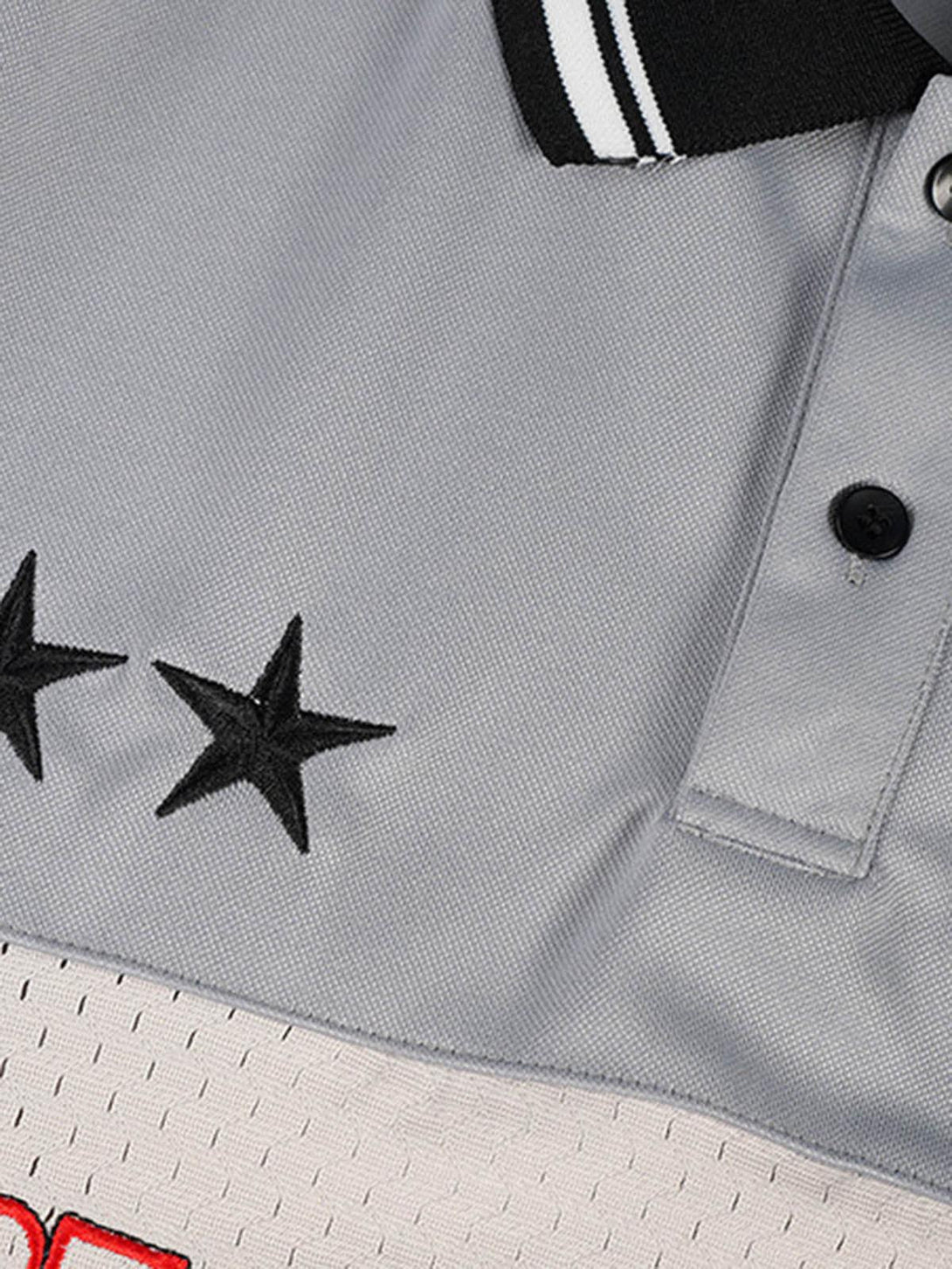 A detailed view of the TALISHKO retro sports jersey polo shirt, showcasing black star accents.