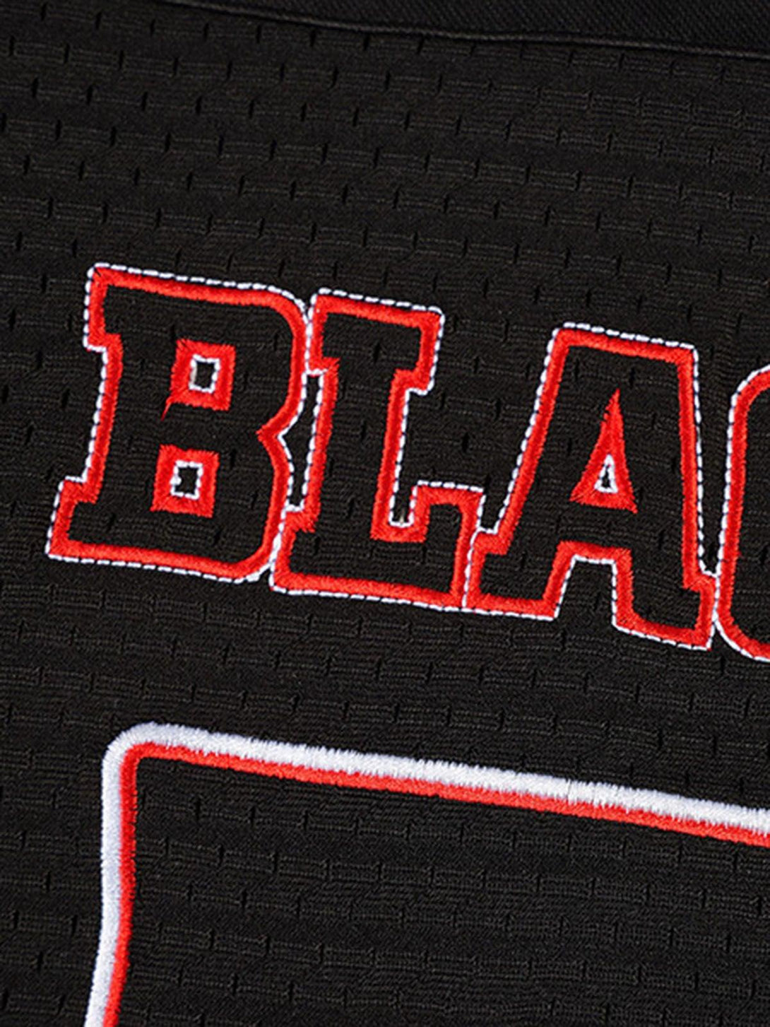 Detailed fabric and stitching on TALISHKO retro sports jersey, showcasing bold red lettering.