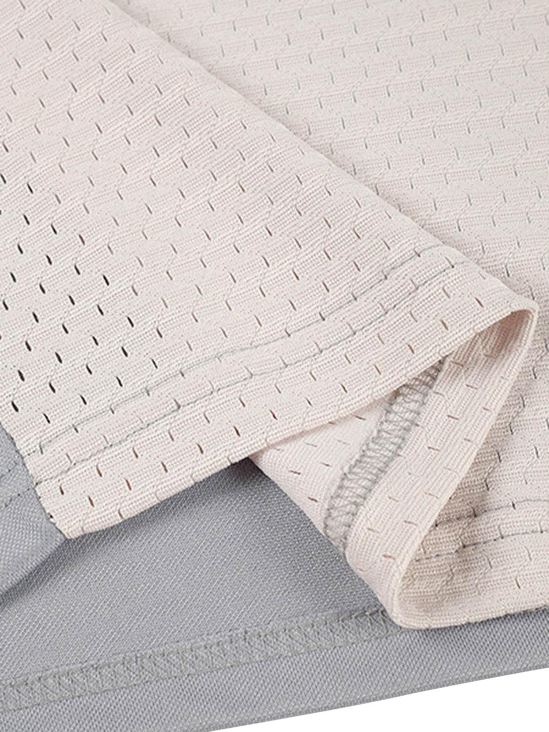 Detailed fabric and stitching on a TALISHKO retro sports jersey polo shirt, highlighting texture.