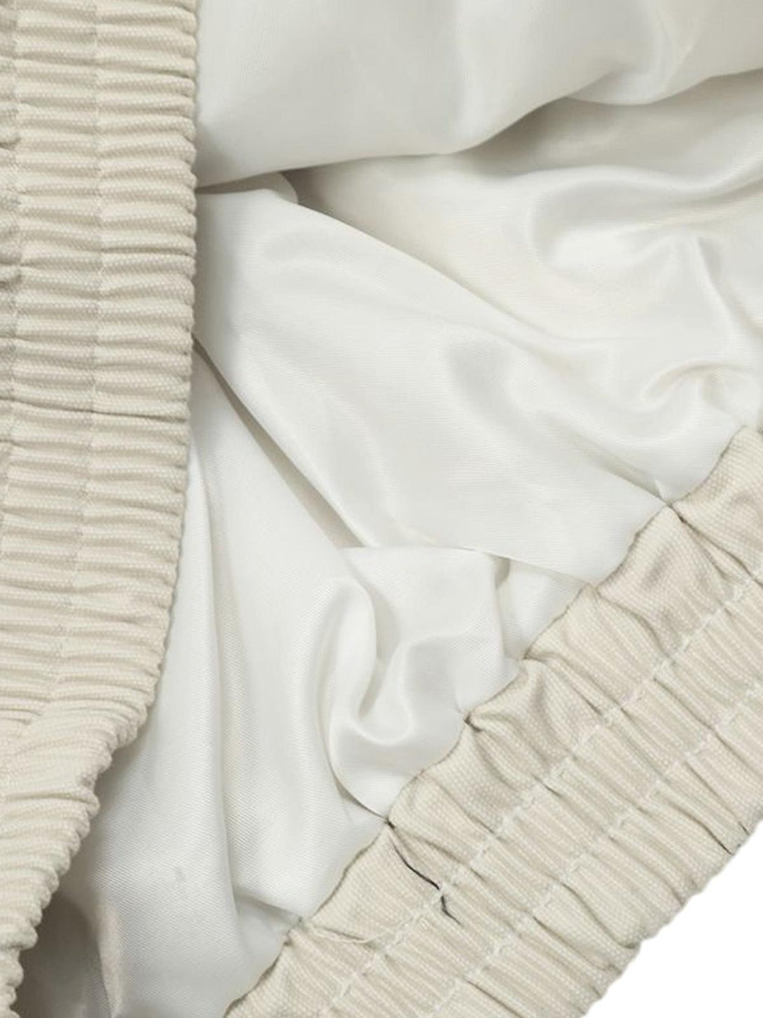 Detailed fabric and stitching on the TALISHKO retro stand collar casual jacket in white.