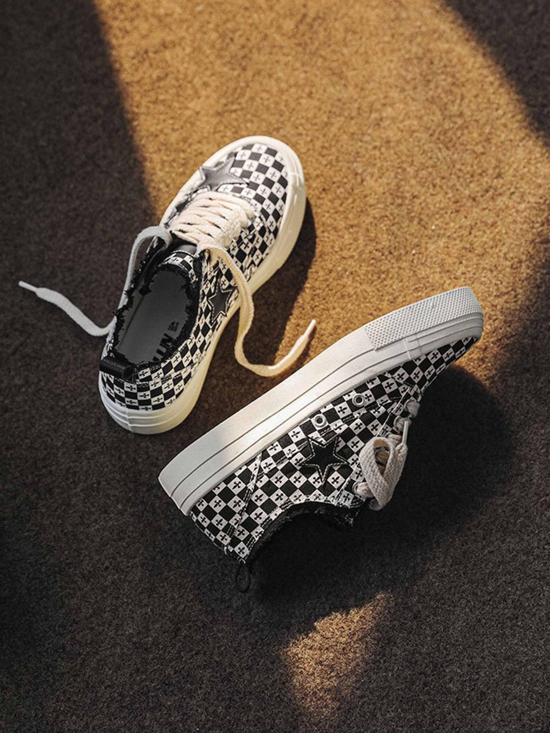 Retro star canvas shoes by TALISHKO, showcasing a bold black and white checkered design.