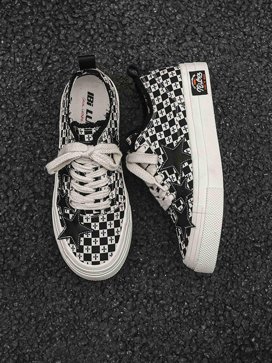 Black and white canvas shoes with star accents by TALISHKO, highlighting a retro checkered design.