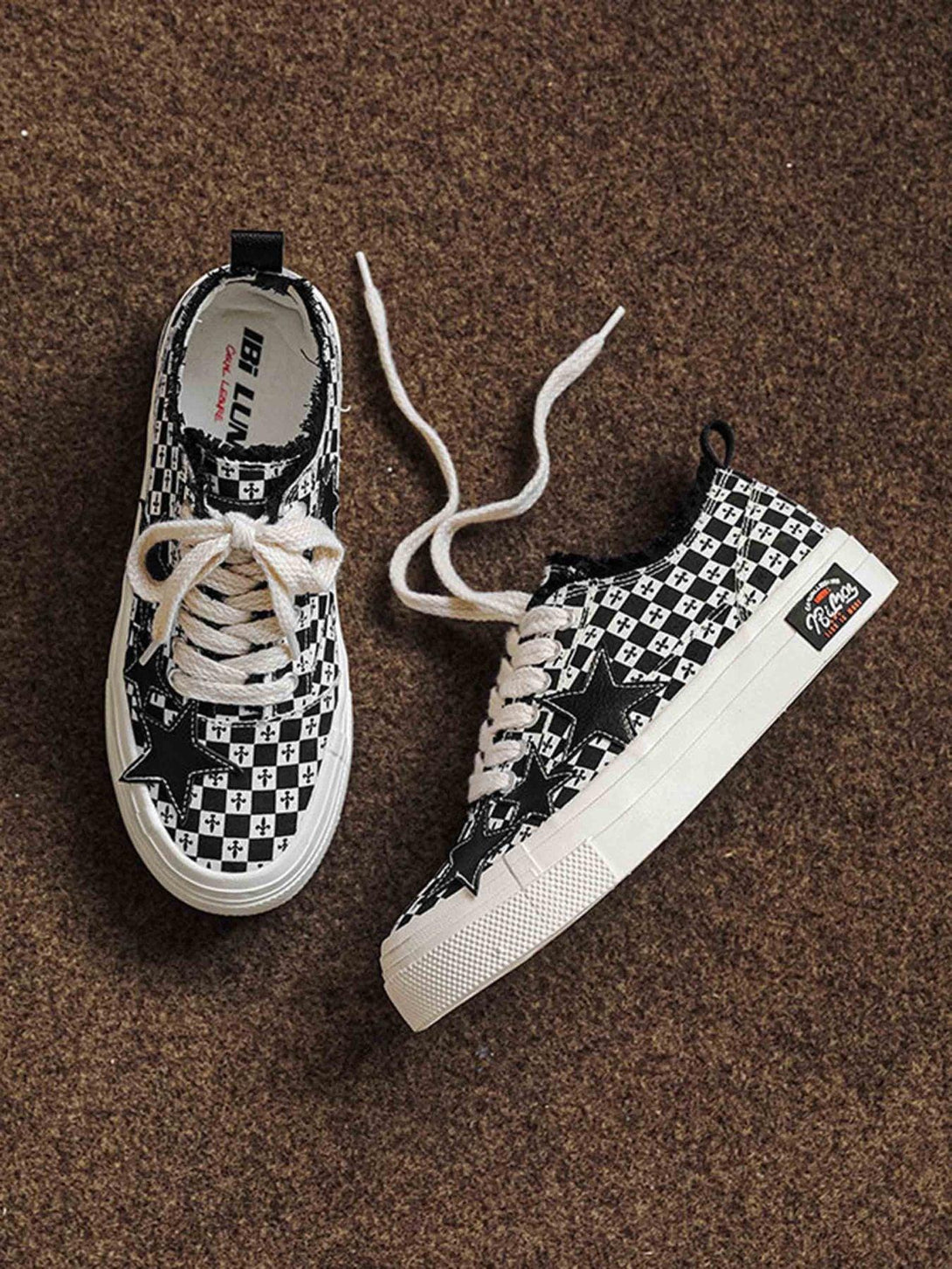 TALISHKO canvas shoes with a retro star design and bold checkered pattern on a textured surface.