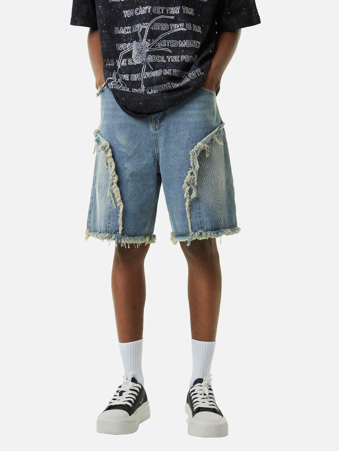Model wearing TALISHKO denim shorts with retro stitching and diamond embroidery, ideal for casual style.