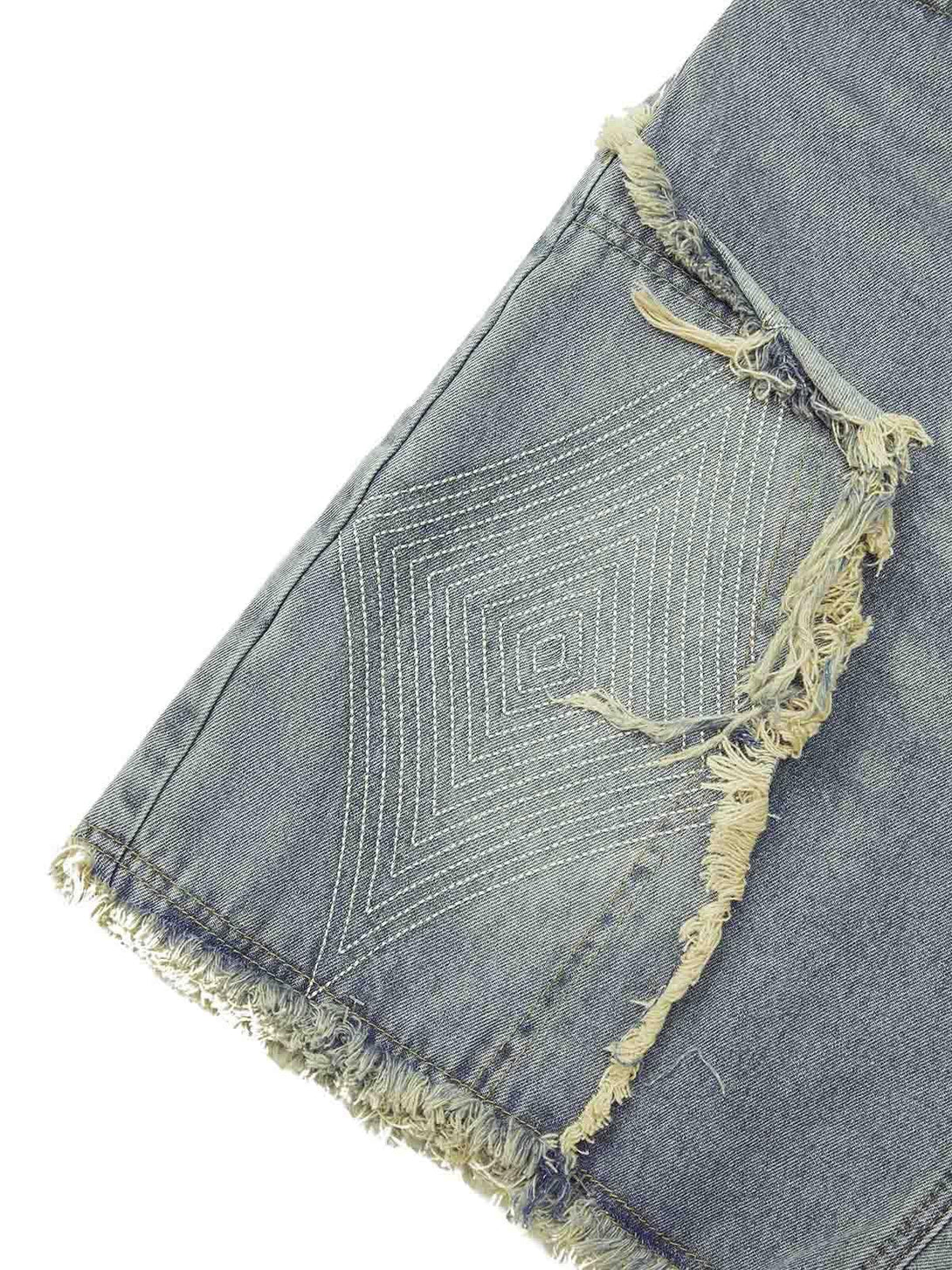 Intricate look at TALISHKO shorts, featuring detailed diamond embroidery and frayed edges.