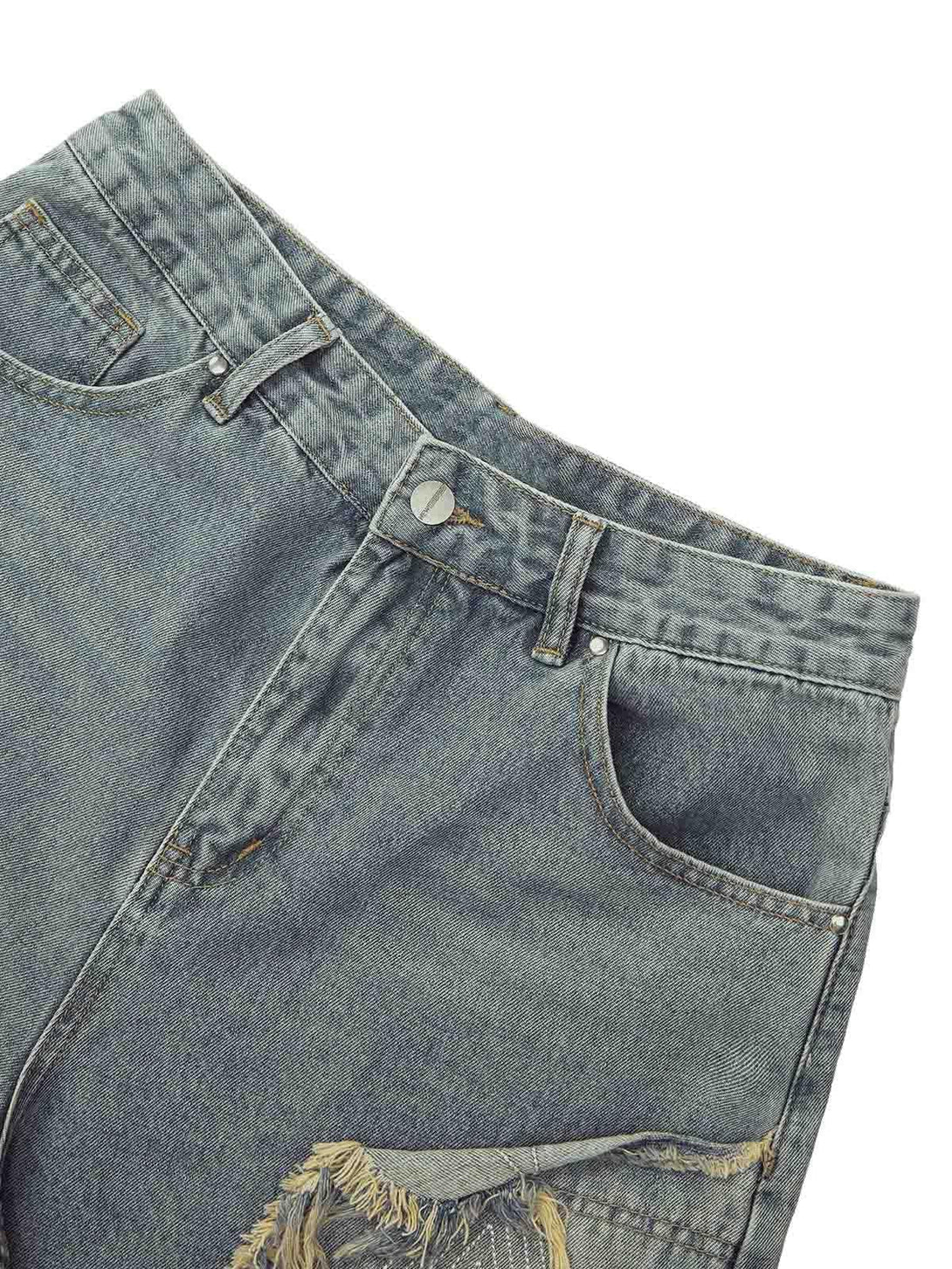 Detailed view of TALISHKO shorts highlighting retro stitching and frayed design elements.