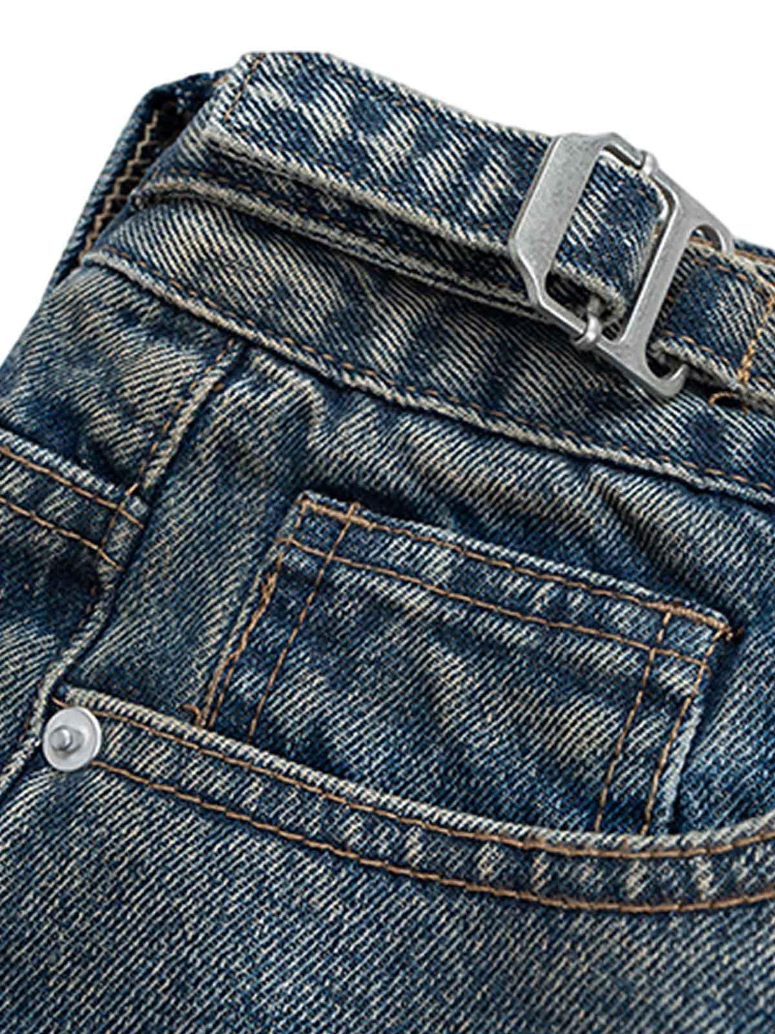 Intricate look at TALISHKO's retro jeans, highlighting stitching and buckle details.