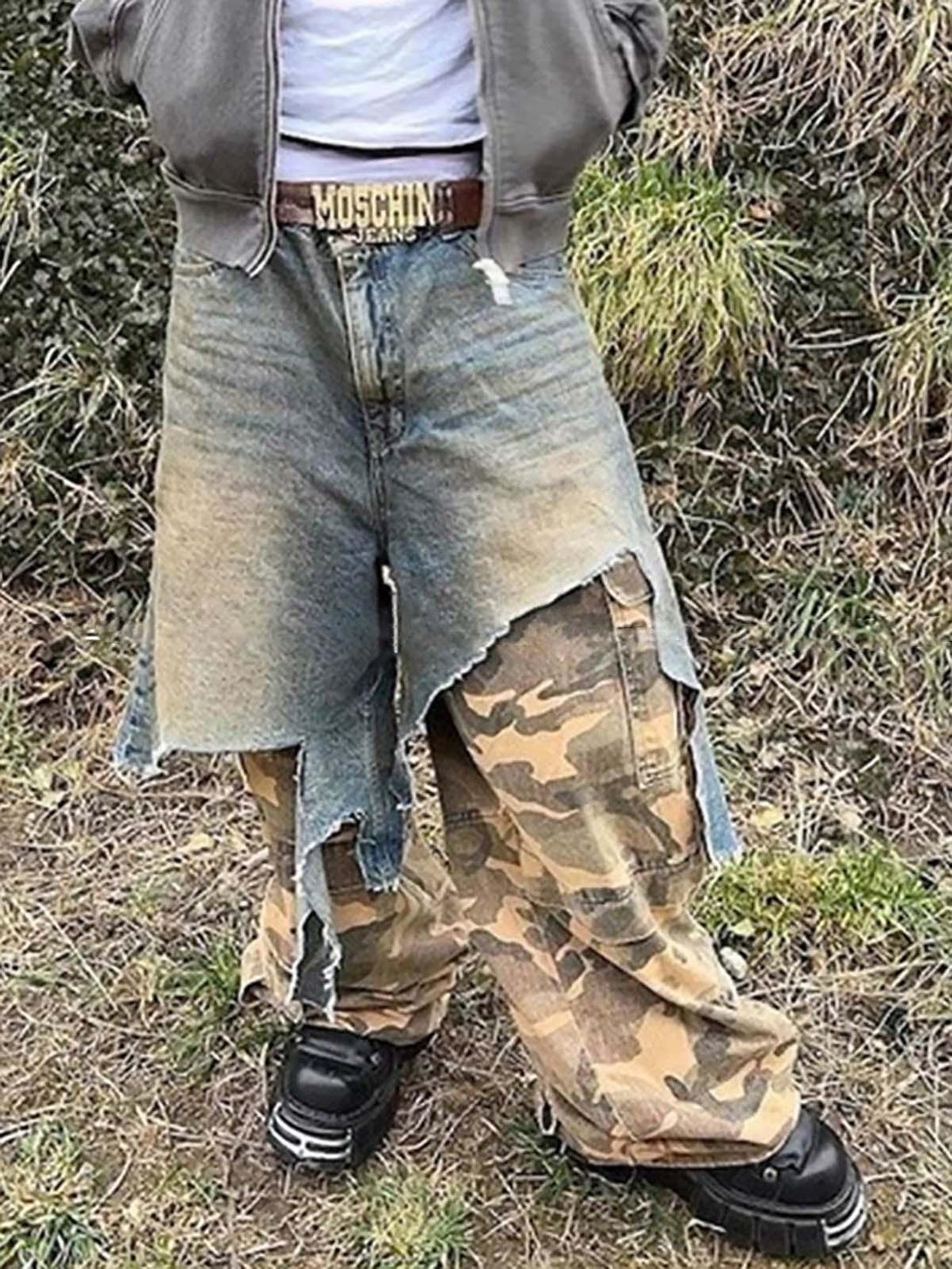 Model wearing TALISHKO's retro camouflage jeans with a unique distressed denim overlay.