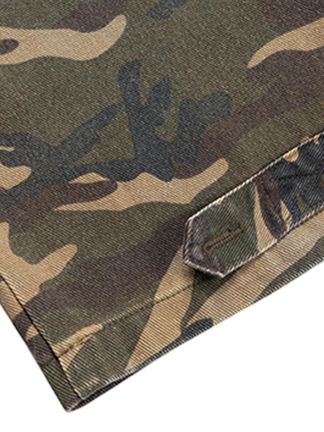 Focusing on the texture of TALISHKO's camouflage jeans, highlighting the detailed stitching.
