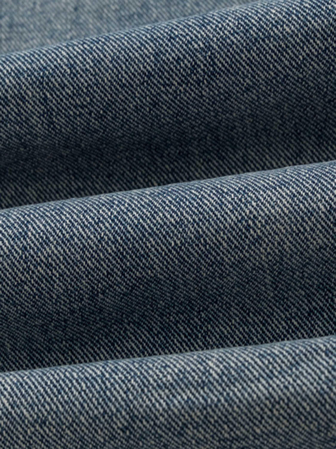 Zoomed-in texture of TALISHKO retro straight casual jeans showcasing the durable denim weave.