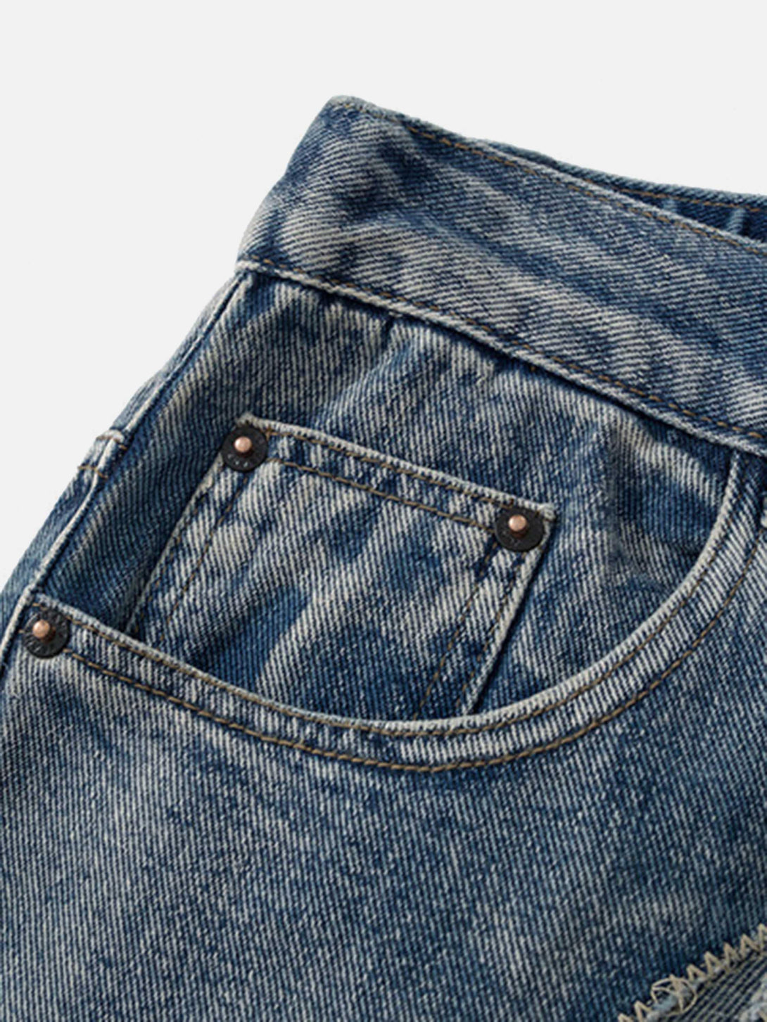 Focusing on the pocket detail of TALISHKO retro straight jeans, highlighting sturdy denim texture.