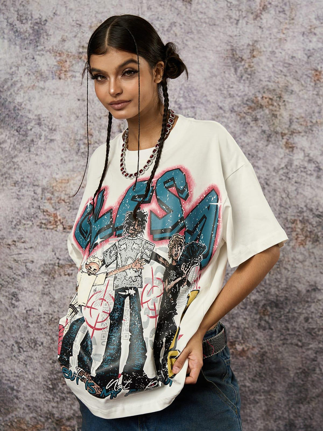 Model wearing a Retro Street GLESA graphic T-shirt with vibrant design, styled by TALISHKO.