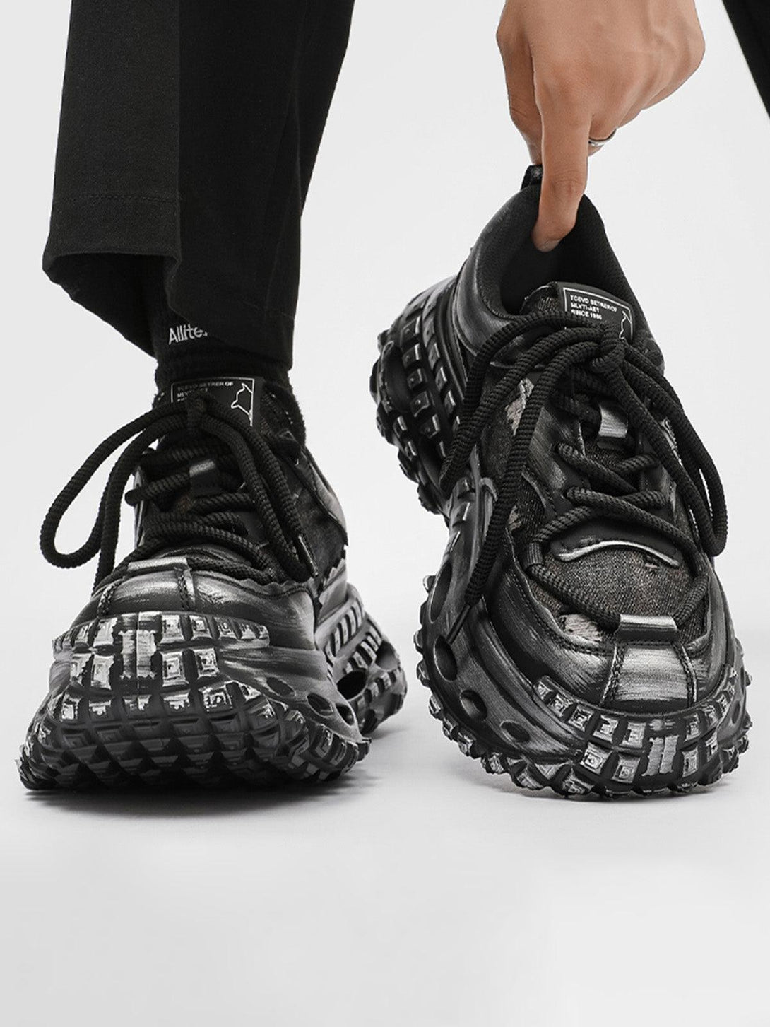 TALISHKO retro chunky sneakers with tire sole detail, adding an edgy touch to any outfit.