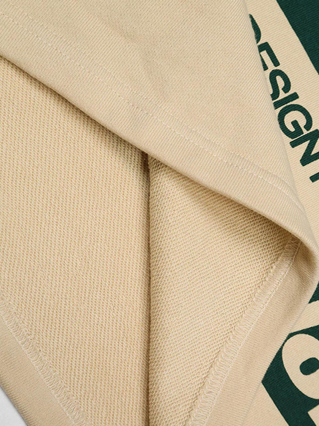 Detailed fabric and stitching of a retro typography polo tee by TALISHKO, showcasing design elements.