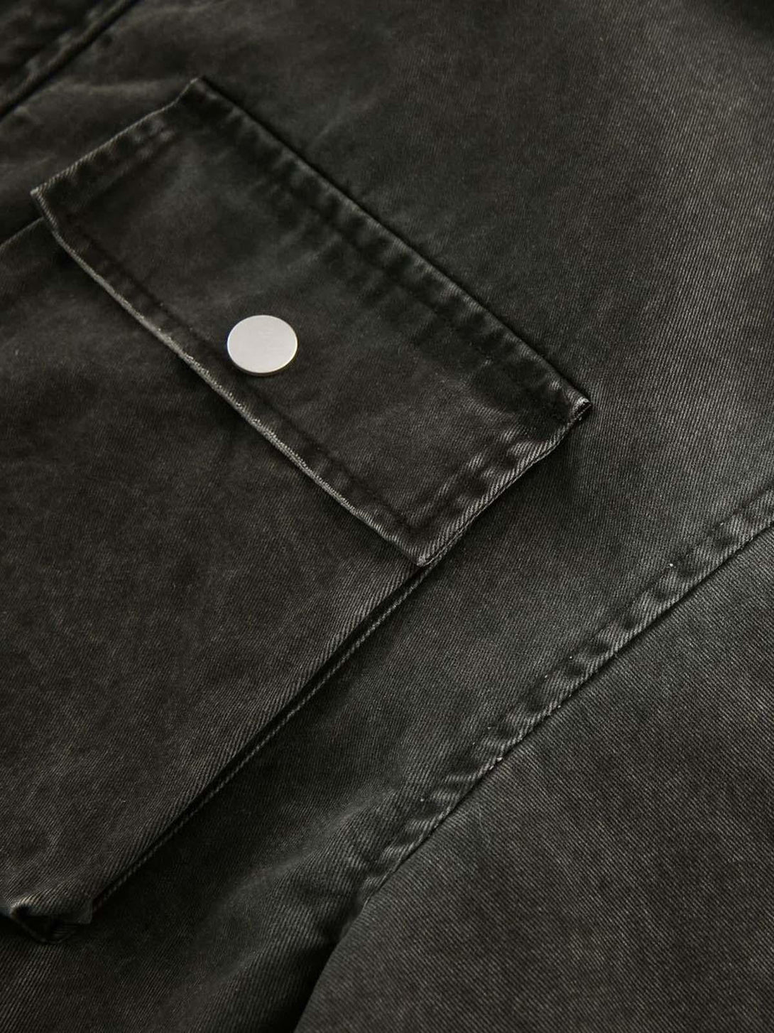 Intricate stitching details on TALISHKO's retro washed work jacket pocket with silver snap.