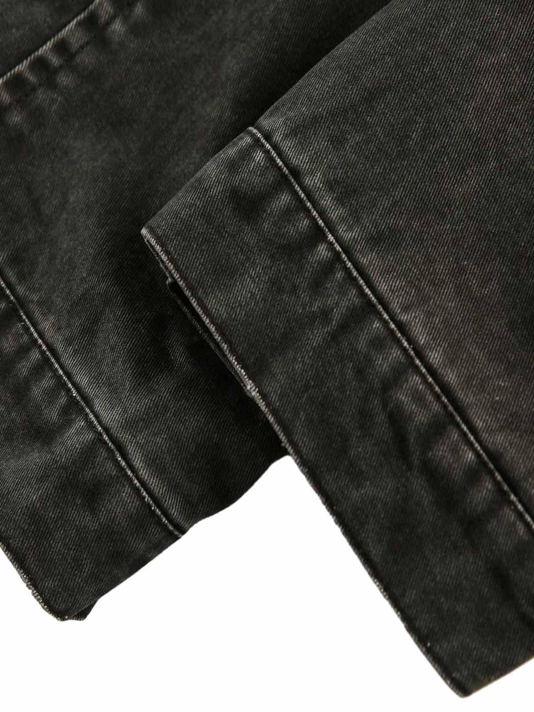 Detailed fabric and stitching of TALISHKO's retro washed work jacket, highlighting craftsmanship.
