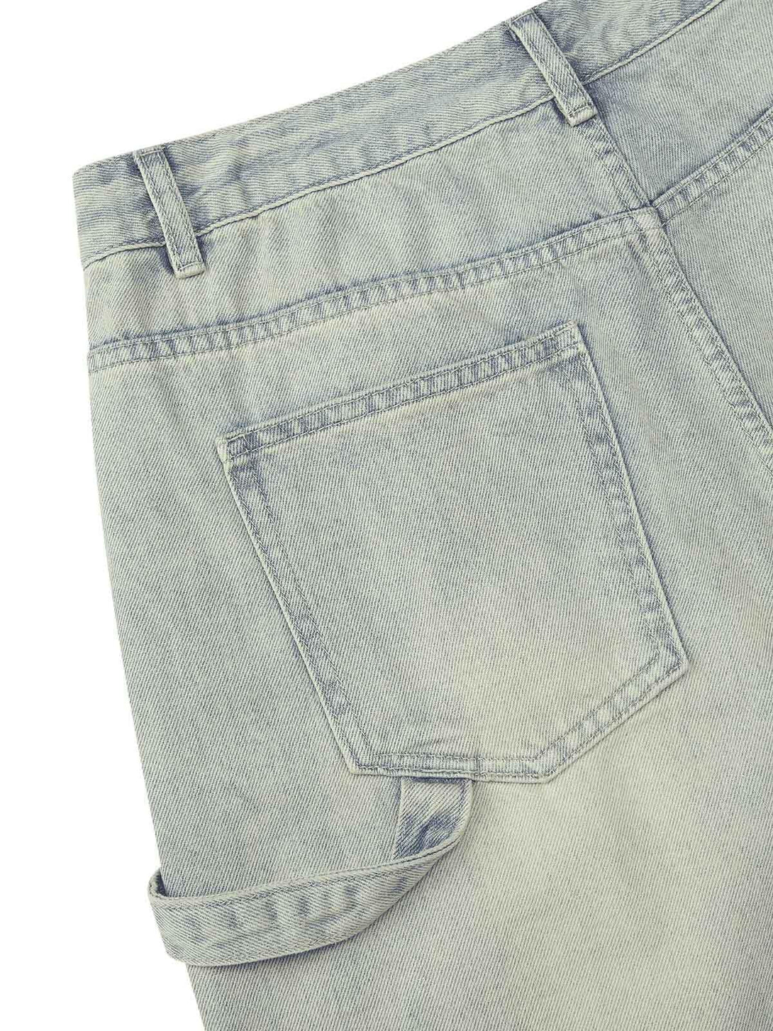 Detailed fabric and stitching of TALISHKO retro washed hip-hop shorts, highlighting pocket design.