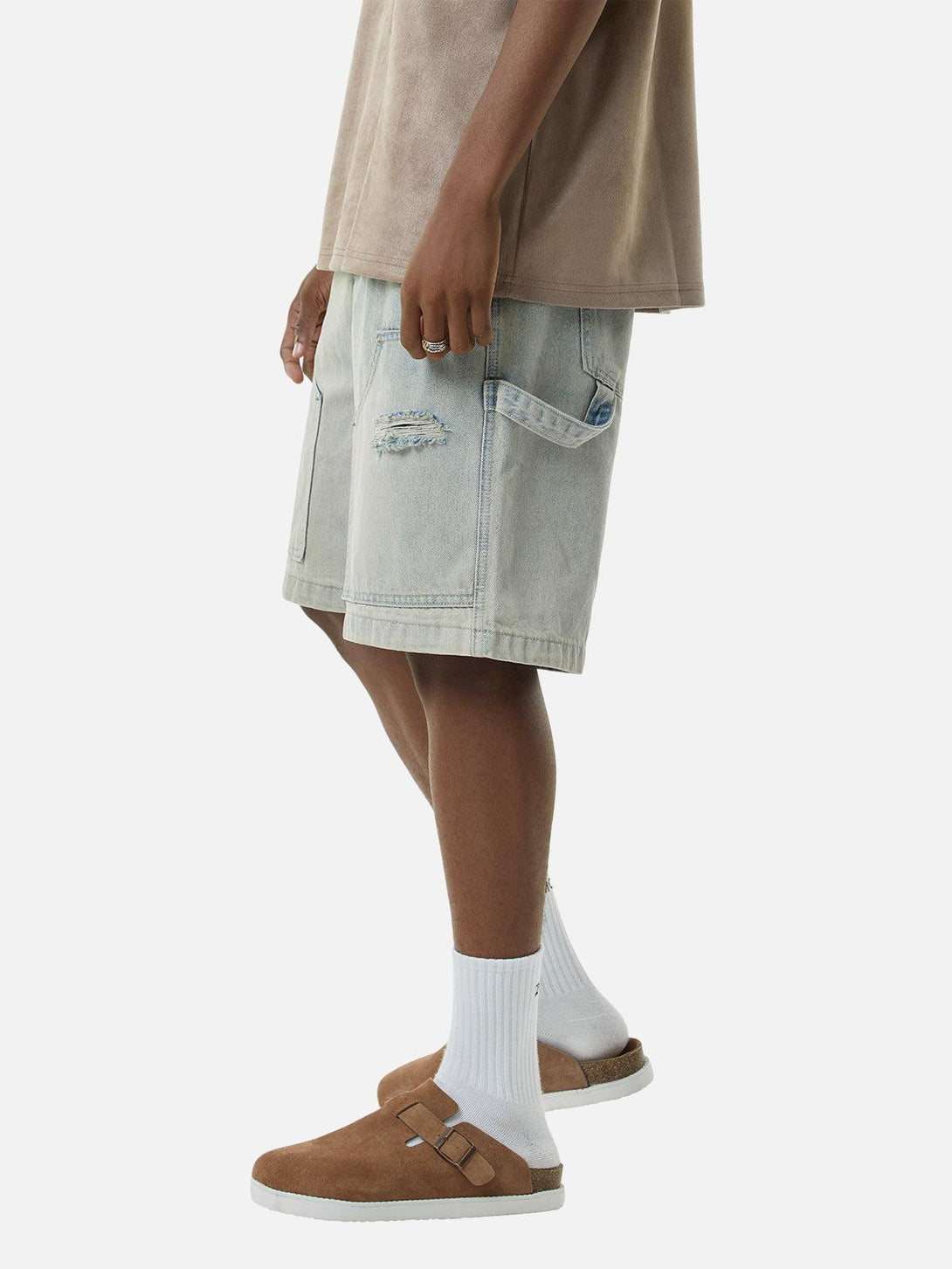 Side view of TALISHKO retro washed hip-hop shorts paired with casual brown sandals and socks.