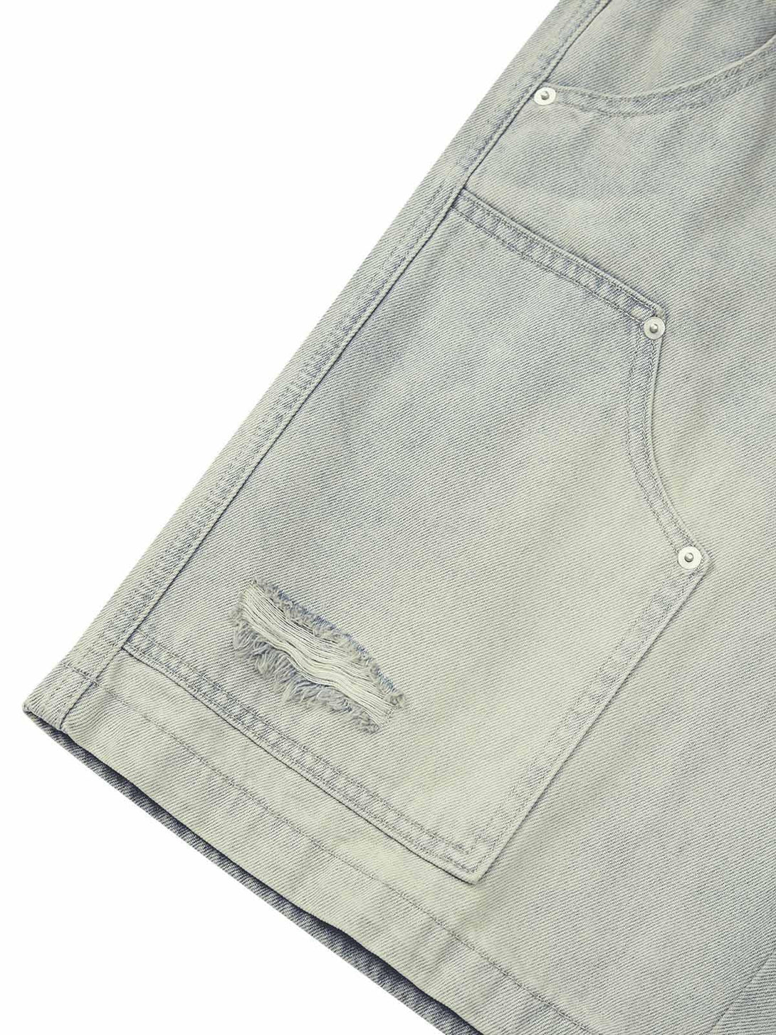 Detailed view of TALISHKO retro washed hip-hop shorts, highlighting textured fabric and stitching.