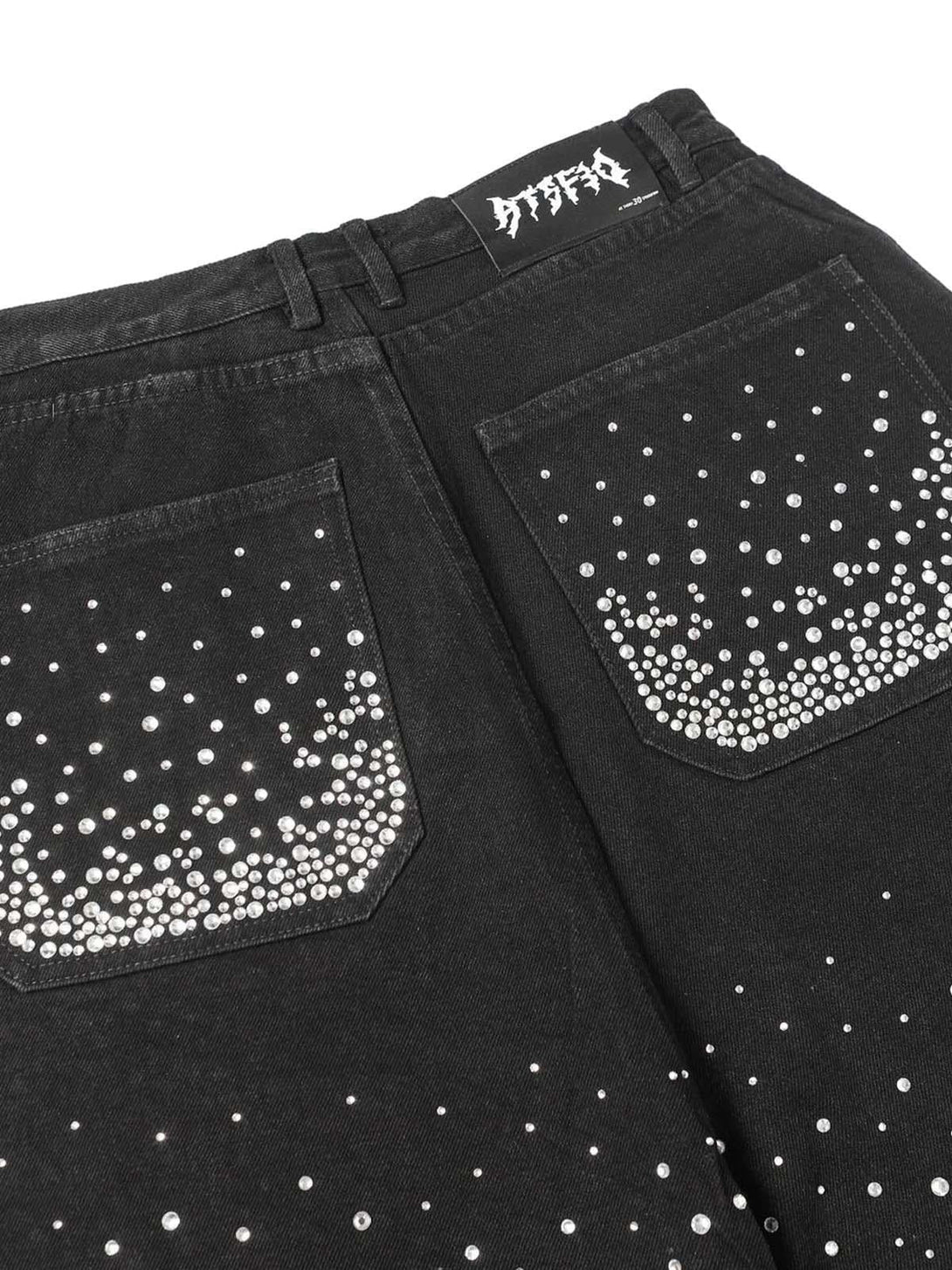 Rhinestone detailing on TALISHKO denim shorts' back pockets, adding retro charm.
