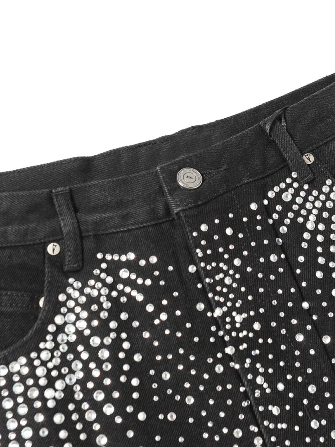 A close-up of TALISHKO denim shorts accentuating rhinestone details and raw edge design.