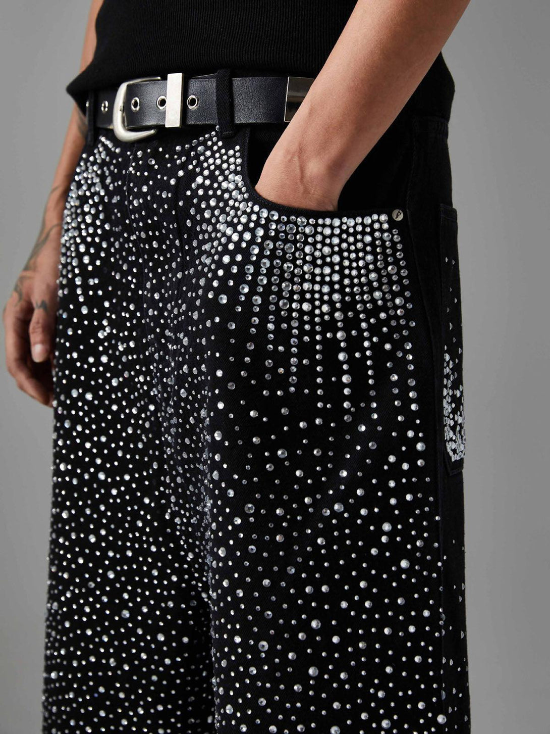 Rhinestone-studded TALISHKO denim shorts detail, showcasing shimmering texture and style.