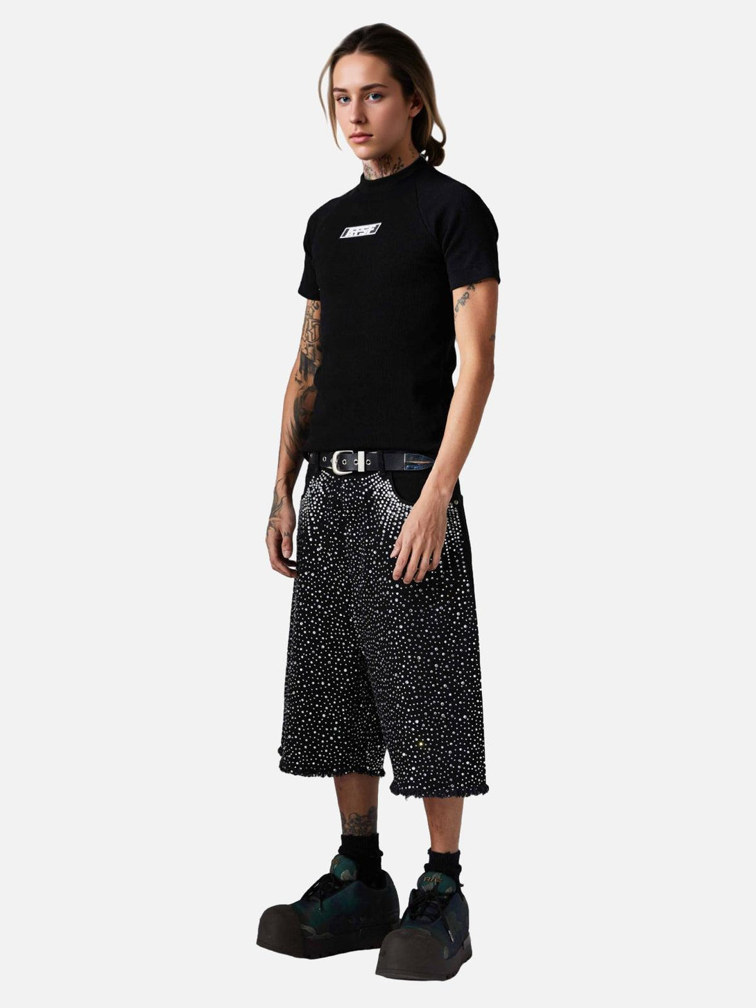Model showcasing TALISHKO retro denim shorts with rhinestones and raw edges, exuding a unique flair.