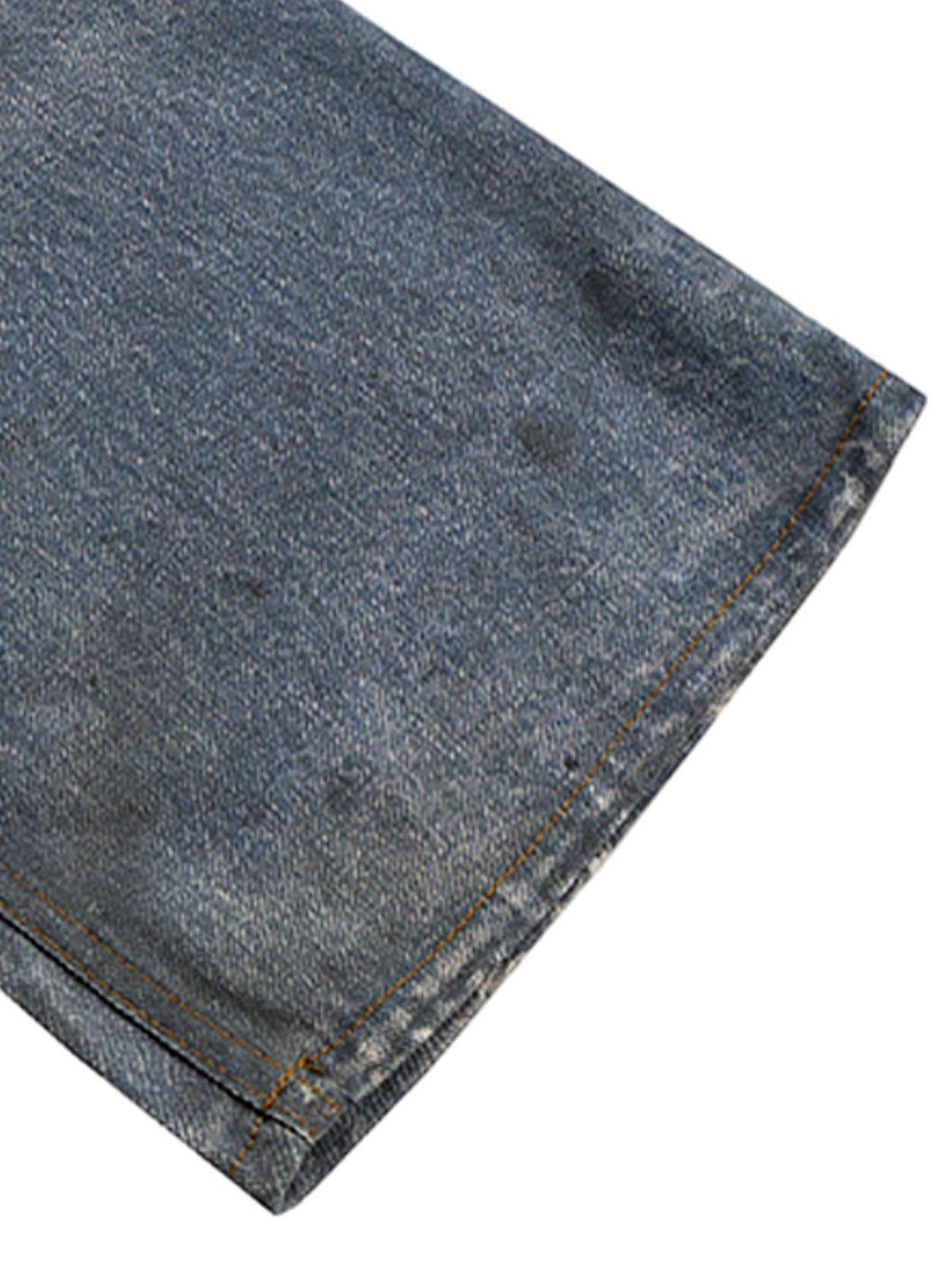 Detailed fabric and stitching of TALISHKO's retro washed flare jeans, highlighting texture.