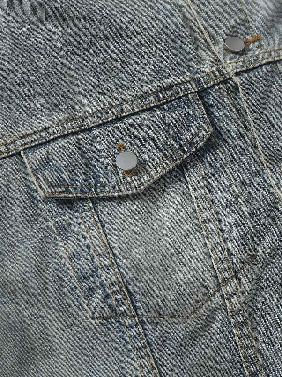 A close-up of TALISHKO's denim jacket pocket, highlighting retro washed texture and stitching.
