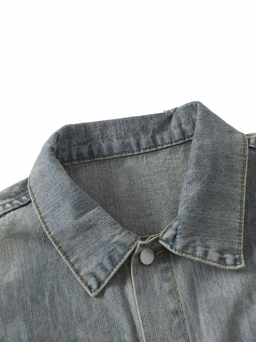 Detailed fabric and stitching of the retro washed denim jacket by TALISHKO.