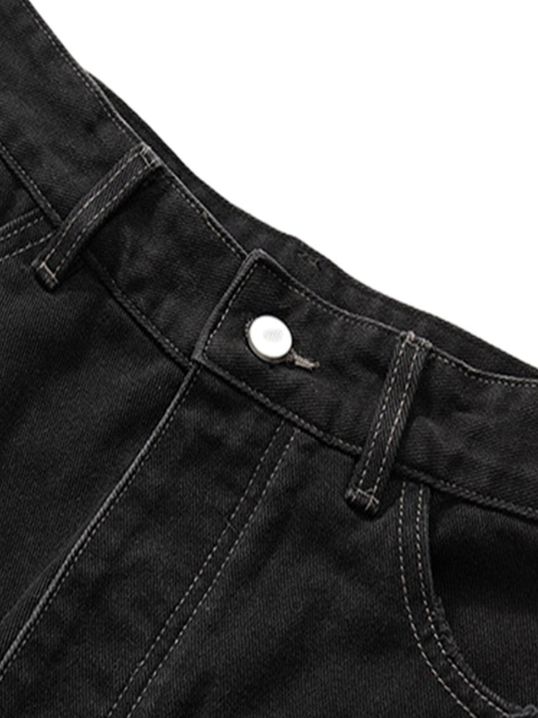 Detailed fabric and stitching on TALISHKO black denim shorts, emphasizing retro style.