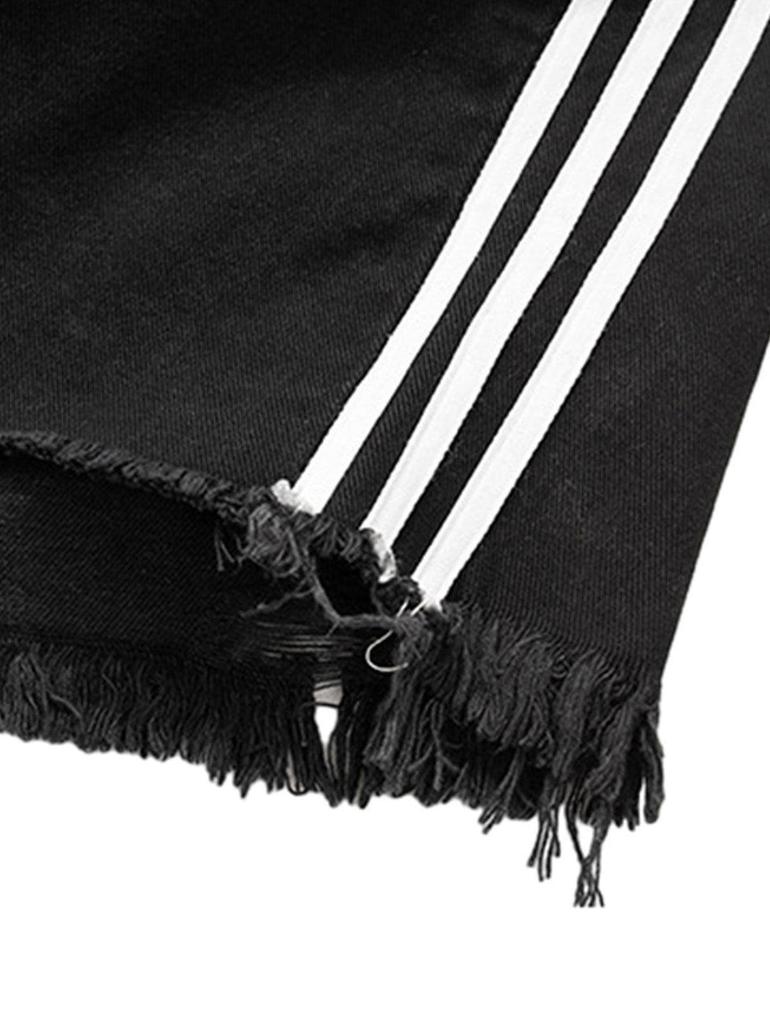 Frayed hem and stripe detail on TALISHKO black denim shorts showcasing retro style.