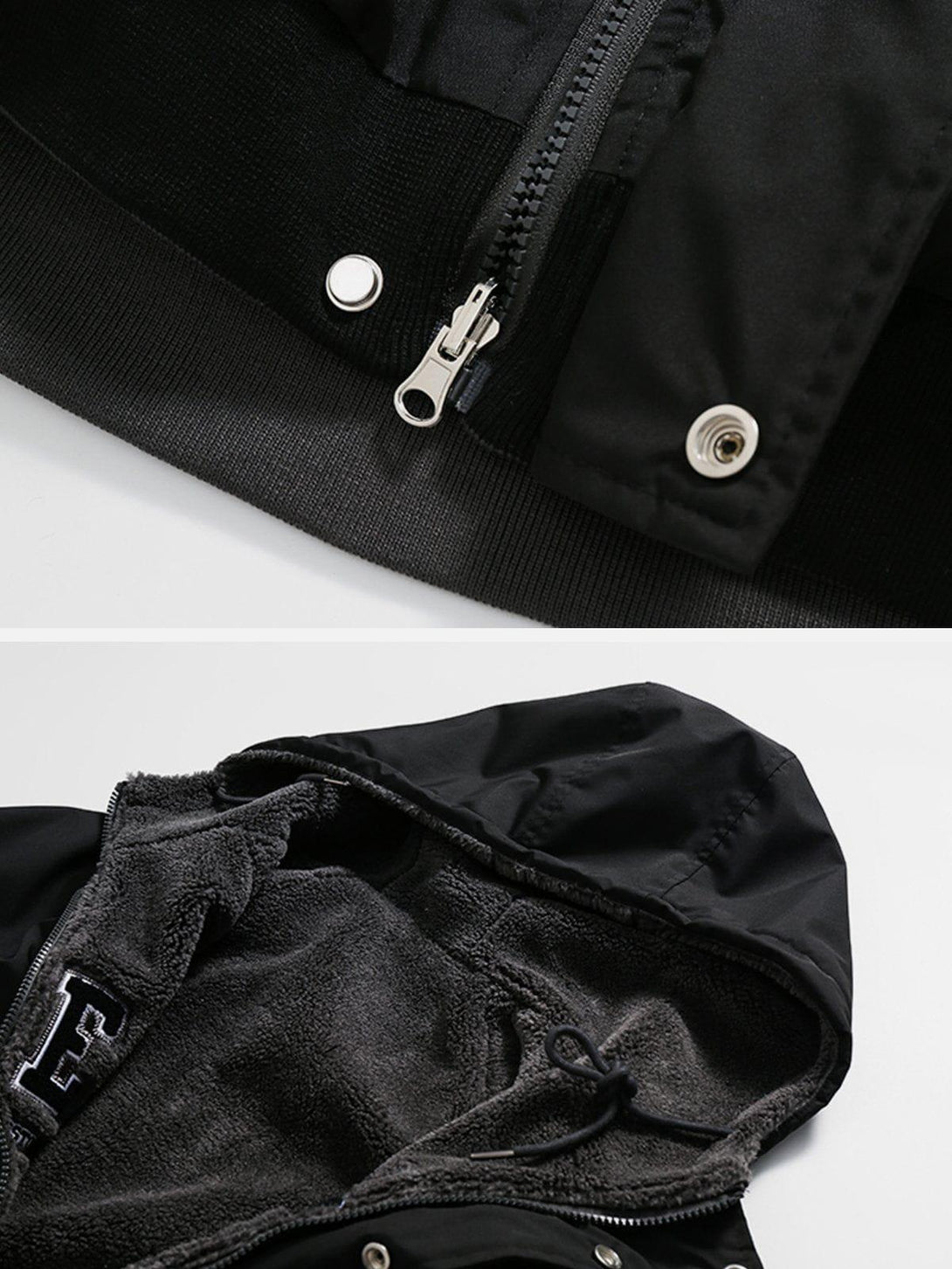 Intricate look at TALISHKO's black reversible Sherpa hoodie, highlighting zipper and lining details.
