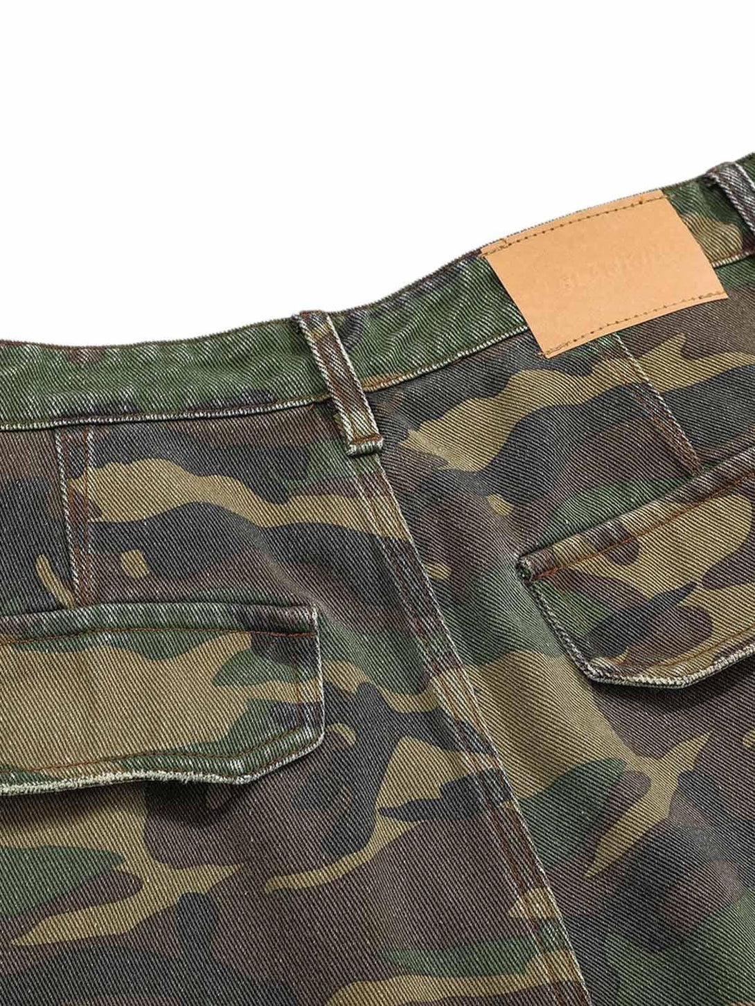 Detailed fabric and stitching on TALISHKO camouflage flared cargo pants, showcasing rugged style.