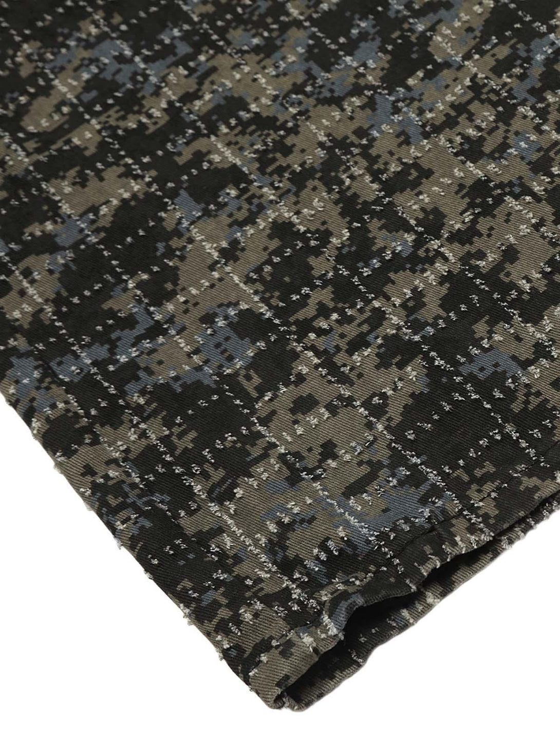 Texture and pattern showcased on TALISHKO's camouflage cargo pants, highlighting durability.