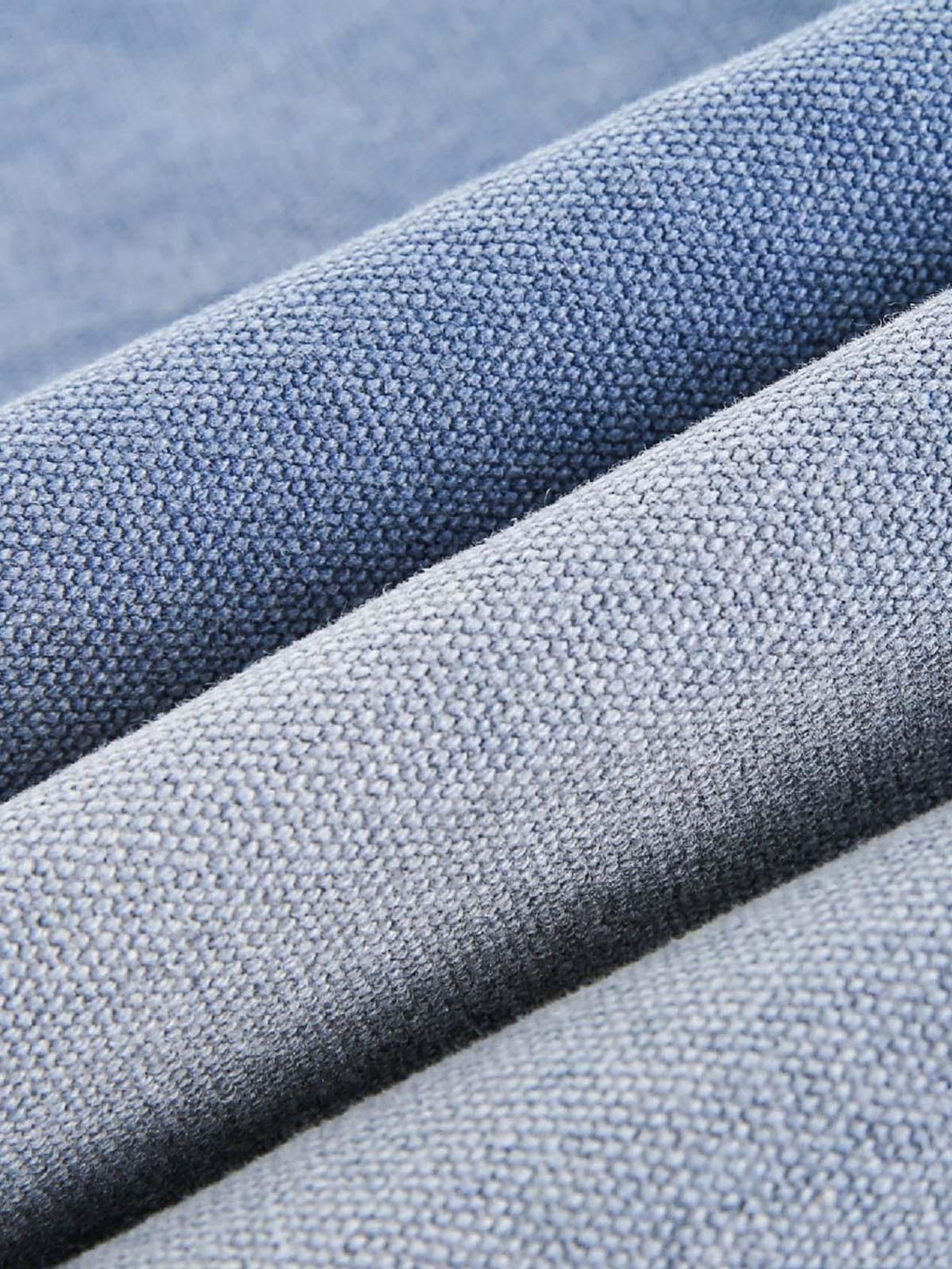 Zoomed-in texture of blue denim fabric, highlighting quality and weave by TALISHKO.