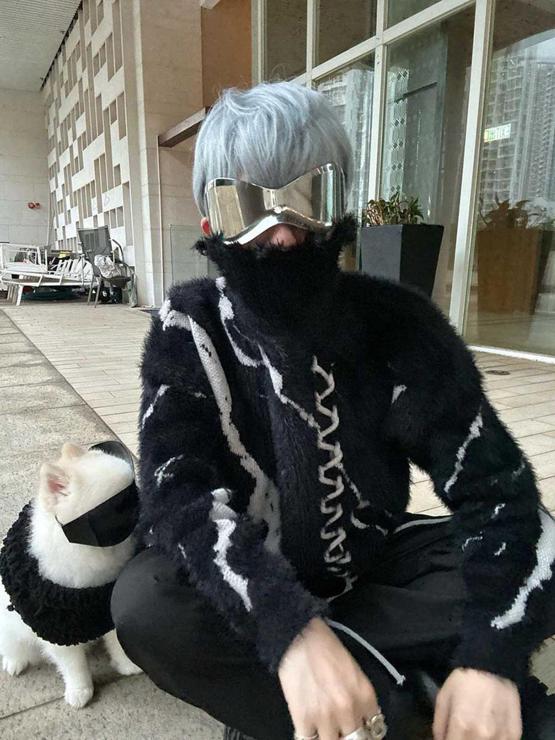 TALISHKO's edgy ripped knit turtleneck sweater styled with futuristic goggles and matching dog outfit.