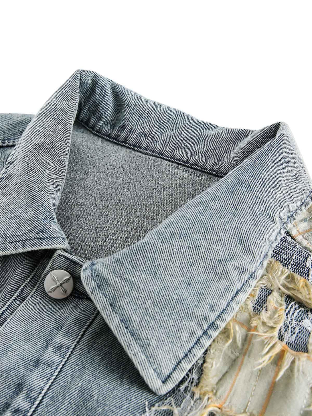 Intricate look at the collar and button details on a TALISHKO ripped lace panel denim jacket.