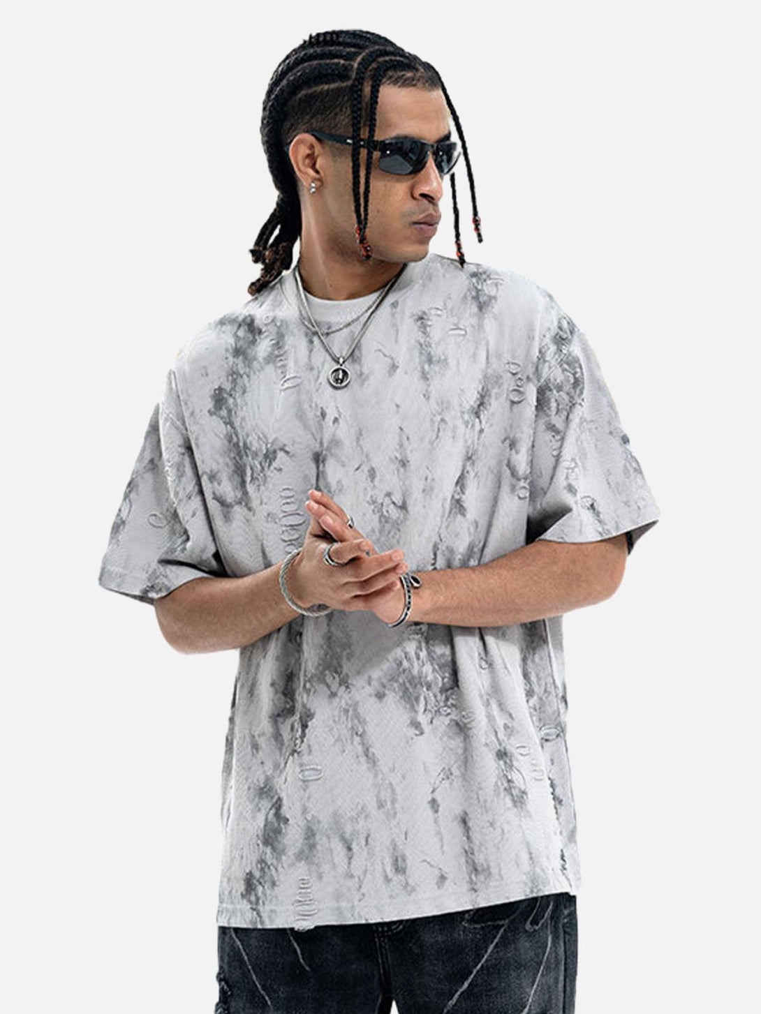 Model wearing a gray TALISHKO ripped tie-dye T-shirt, paired with stylish accessories.