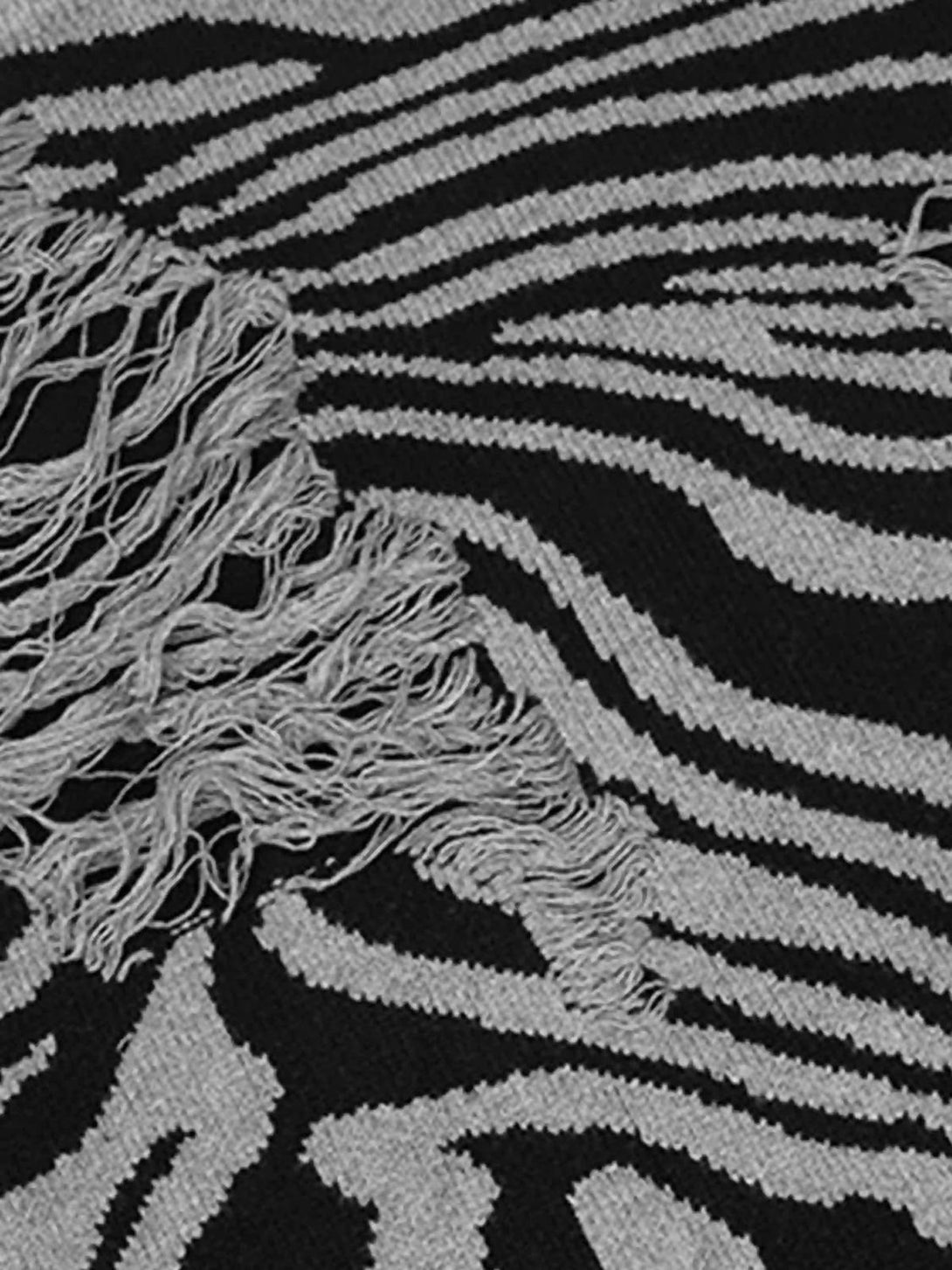 Ripped zebra pattern and texture showcased in this TALISHKO sweater, highlighting unique design.